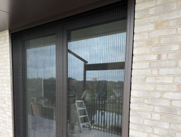 Vliegenschuifraam of Plissehordeur